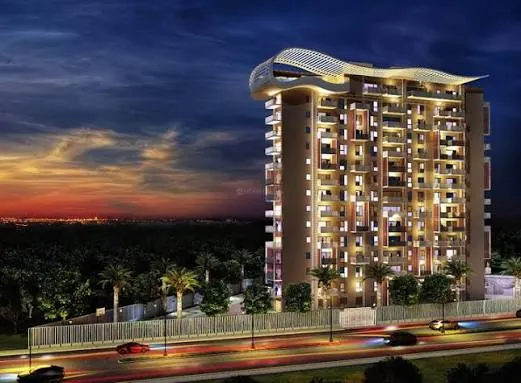 Premia high-rise in Jakkur, North Bengaluru, lit up at dusk with its signature curved rooftop canopy