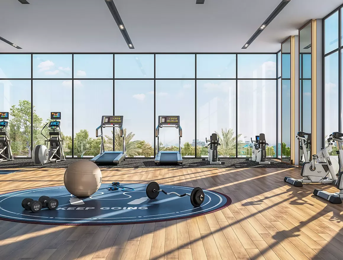 Gym with floor-to-ceiling glass at the Sattva La Vita clubhouse
