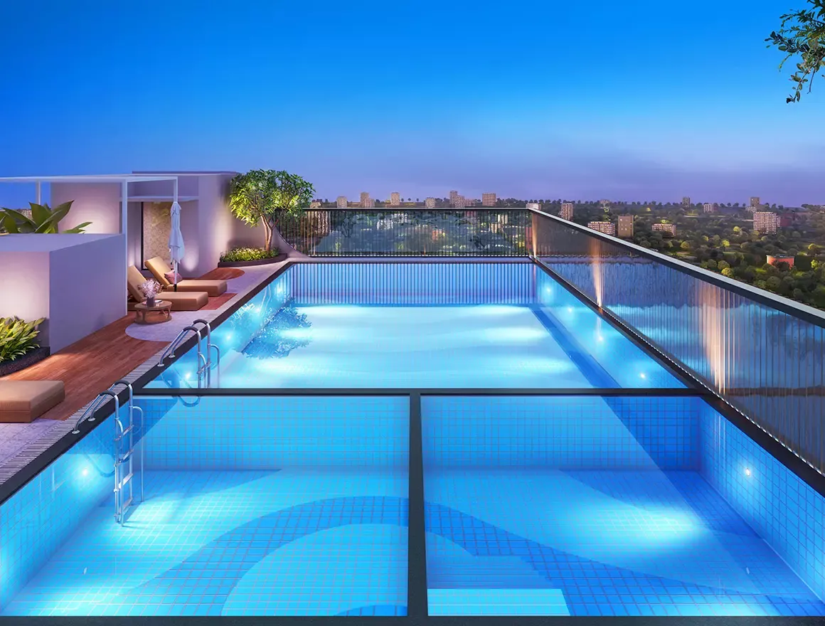 Swimming pool lit at dusk at Sattva La Vita