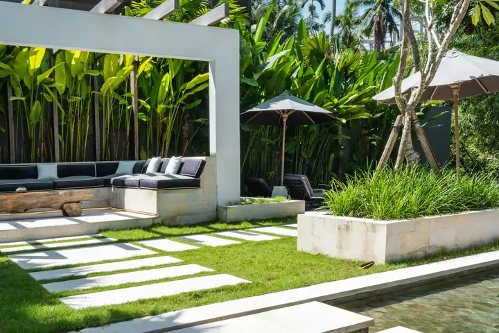 Sample image - tropical villa courtyard with pergola lounge, lawn and stepping stones over water. Project photographs will replace it.