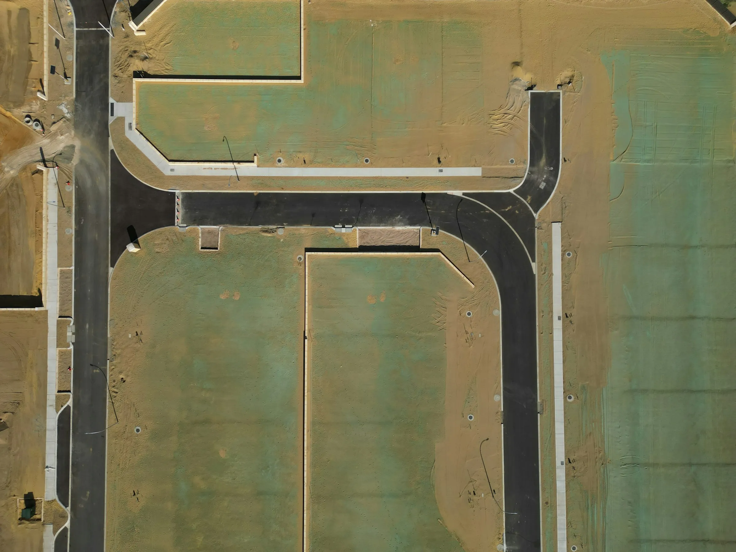 Aerial view of a new plotted residential layout with internal roads